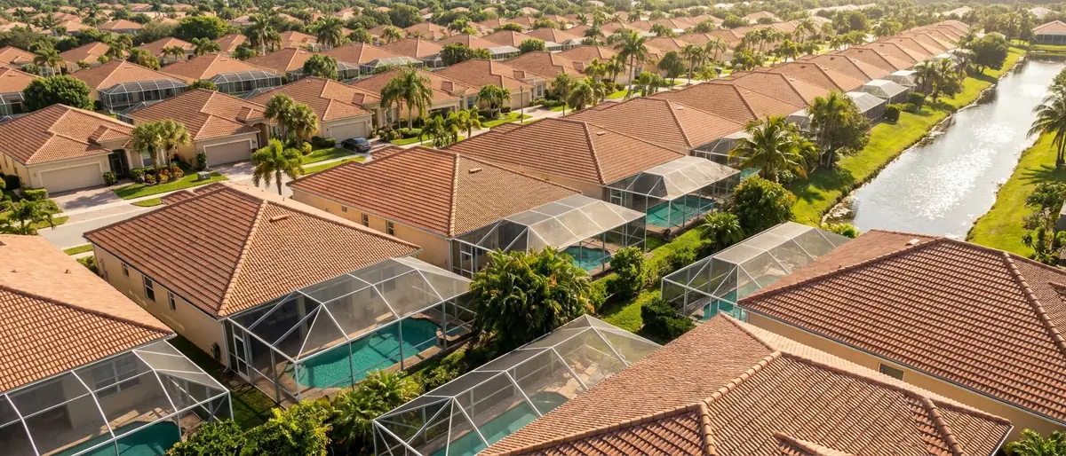 Screened pool enclosures in back yard after back yard across a Miami-Dade neighbourhood